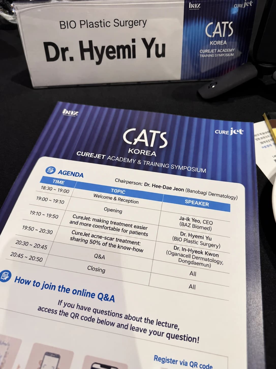 Nameplate and program from a CureJet educational event
