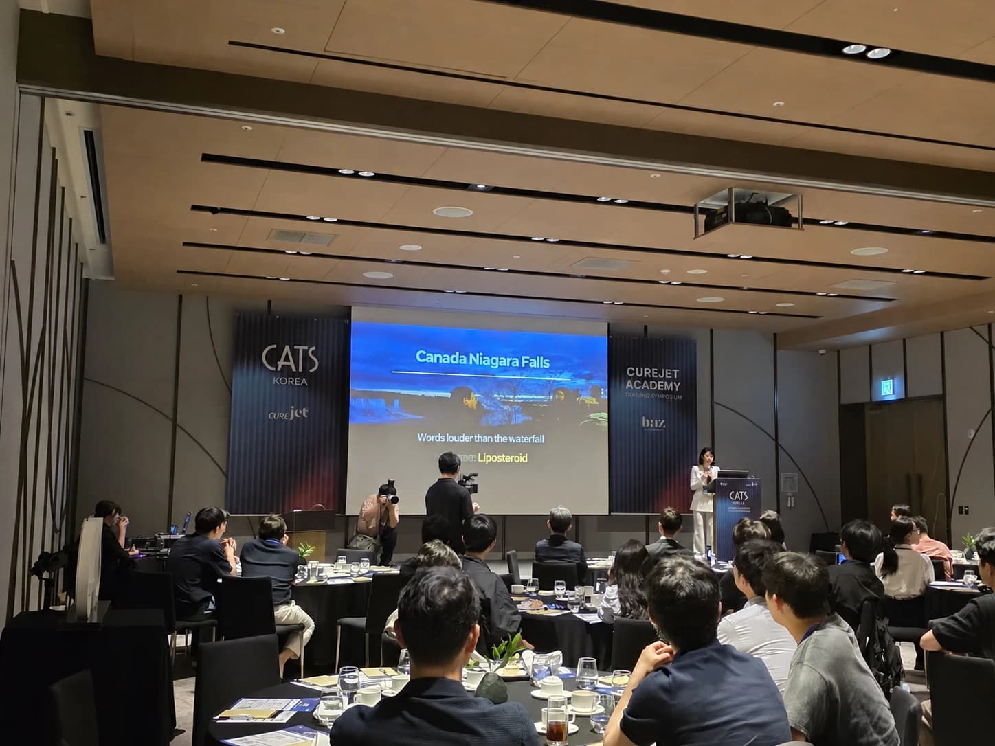 A CUREJET symposium presentation with an English translation of the slide text