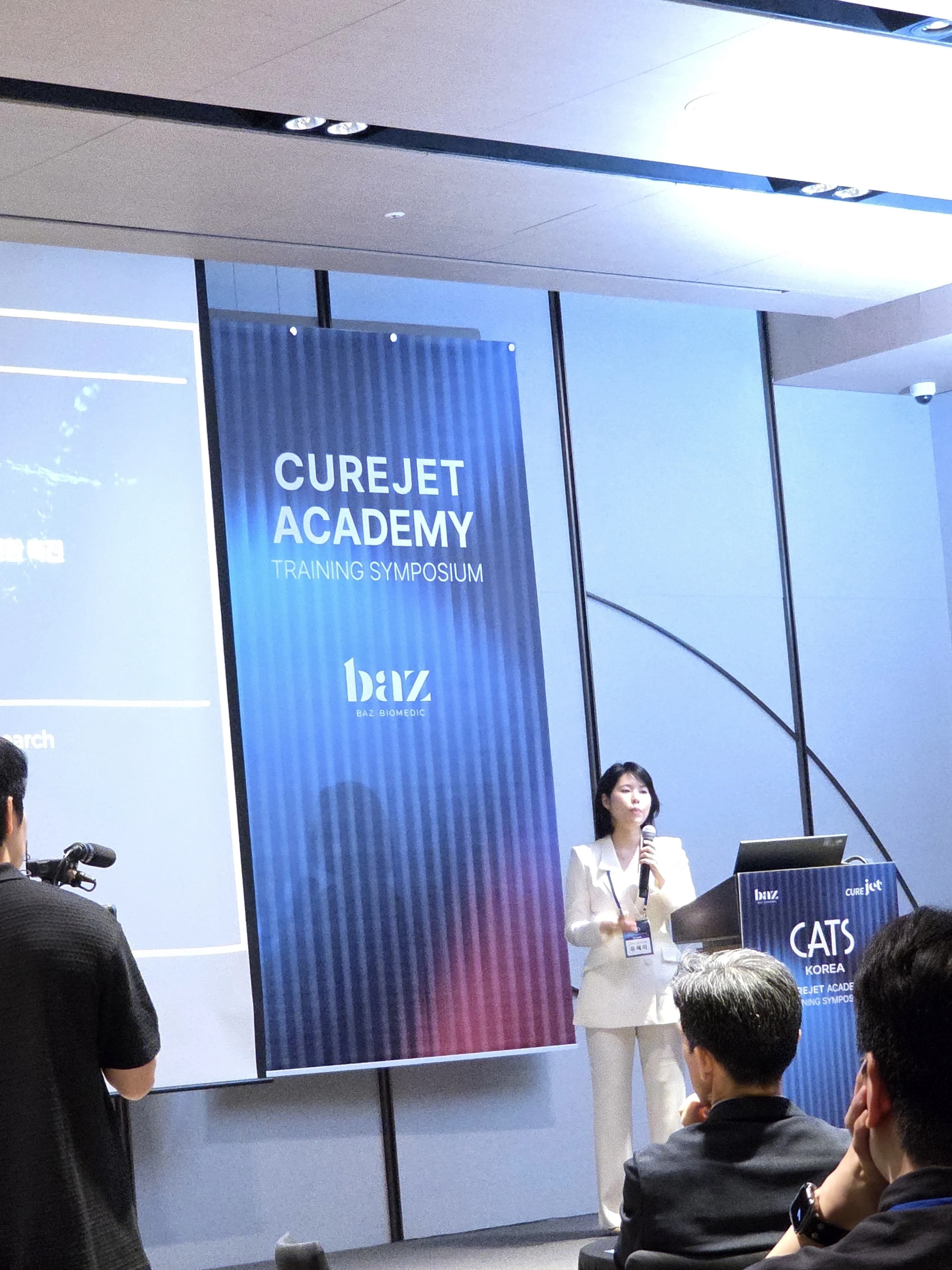 Dr. Hyemi Yu speaking at the CUREJET Academy symposium